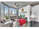 Open living area with floor-to-ceiling windows offering city views, concrete ceilings, and sleek modern decor at 860 Peachtree Ne St # 1502, Atlanta, GA 30308