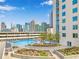 Relax by the rooftop pool with city views, surrounded by lush landscaping and comfortable lounge chairs at 860 Peachtree Ne St # 1502, Atlanta, GA 30308