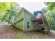Elevated deck provides the perfect outdoor space, surrounded by a private wooded lot and gentle hillside at 1737 Mount Berry Dr, Douglasville, GA 30135