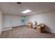 Basement featuring cozy seating and ample open space, perfect for relaxation at 1737 Mount Berry Dr, Douglasville, GA 30135