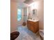 Bathroom featuring modern vanity with ample storage and a bright window at 1737 Mount Berry Dr, Douglasville, GA 30135