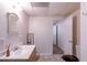 Bathroom with single vanity sink and an entry into a bedroom area at 1737 Mount Berry Dr, Douglasville, GA 30135
