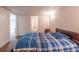Cozy bedroom featuring carpet flooring, neutral walls, and plenty of natural light through open doorways at 1737 Mount Berry Dr, Douglasville, GA 30135