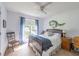 Charming bedroom with a ceiling fan, curtains, and natural light at 1737 Mount Berry Dr, Douglasville, GA 30135