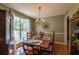 Classic dining room with hardwood floors, ample natural light, and traditional furnishings at 1737 Mount Berry Dr, Douglasville, GA 30135
