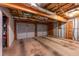 Spacious unfinished garage with bare concrete floors offers room for storage, a workshop, and vehicle parking at 1737 Mount Berry Dr, Douglasville, GA 30135