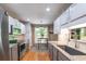 Modern kitchen featuring stainless steel appliances, granite countertops, and ample cabinet space at 1737 Mount Berry Dr, Douglasville, GA 30135