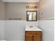Bathroom featuring white tiled walls and a wooden vanity with sink at 3170 Bellgreen Way, Decatur, GA 30032