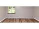 Bedroom featuring hardwood floors and a window with a view outside at 3170 Bellgreen Way, Decatur, GA 30032