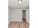 Neutral bedroom featuring wood-look floors and a closet at 3170 Bellgreen Way, Decatur, GA 30032