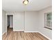 Neutral bedroom with wood-look floors and a window at 3170 Bellgreen Way, Decatur, GA 30032