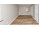 A bedroom showcasing hardwood floors and natural light from the window at 3170 Bellgreen Way, Decatur, GA 30032