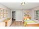 Bedroom with wood-look floors, a bed, and decorative art at 3170 Bellgreen Way, Decatur, GA 30032