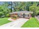 Attractive brick home with a spacious driveway and landscaped front yard at 3170 Bellgreen Way, Decatur, GA 30032