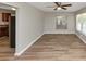 Clean and bright living room with hardwood floors and neutral wall color at 3170 Bellgreen Way, Decatur, GA 30032