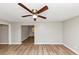 Cozy room featuring hardwood floors and a modern ceiling fan at 3170 Bellgreen Way, Decatur, GA 30032