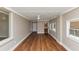Sunroom featuring hardwood floors, painted brick walls, and a ceiling fan at 3170 Bellgreen Way, Decatur, GA 30032