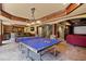Finished basement with a ping pong table, bar, and a projector screen for movie nights at 4250 Old Oak Trce, Cumming, GA 30041