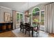 Bright dining room with a large window overlooking a landscaped backyard at 4250 Old Oak Trce, Cumming, GA 30041