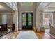 Inviting foyer with hardwood floors, grand entrance, and decorative details at 4250 Old Oak Trce, Cumming, GA 30041