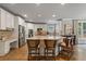 Stylish kitchen with white cabinets, stainless steel appliances, granite countertops, and bar seating at 4250 Old Oak Trce, Cumming, GA 30041