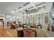 Large living room with coffered ceilings, large windows, hardwood floors, and stylish furniture at 4250 Old Oak Trce, Cumming, GA 30041