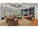 Cozy living room with fireplace, built-in bookshelves, and coffered ceiling at 4250 Old Oak Trce, Cumming, GA 30041