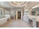 Expansive bathroom featuring a soaking tub, walk-in shower, and dual vanities at 4250 Old Oak Trce, Cumming, GA 30041