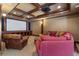 Home theater with projector, screen, comfortable seating, and custom wood trim at 4250 Old Oak Trce, Cumming, GA 30041