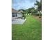 Well-manicured backyard with lush green grass, patio, and neatly trimmed landscaping at 1382 Fountain Lakes Drive Dr, Lawrenceville, GA 30043