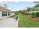 Well-maintained backyard with a concrete patio, manicured lawn, and privacy landscaping at 1382 Fountain Lakes Drive Dr, Lawrenceville, GA 30043
