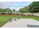 Backyard featuring a concrete patio with seating, lush lawn, and privacy fence at 1382 Fountain Lakes Drive Dr, Lawrenceville, GA 30043
