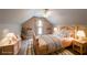 Bright bedroom with a sloped ceiling, ceiling fan, and decoratively furnished in a contemporary design at 1382 Fountain Lakes Drive Dr, Lawrenceville, GA 30043