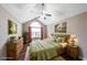 Bedroom featuring high ceilings, hardwood floors, and an arched window at 1382 Fountain Lakes Drive Dr, Lawrenceville, GA 30043