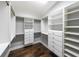 Spacious walk-in closet with built-in shelving and hardwood floors at 1382 Fountain Lakes Drive Dr, Lawrenceville, GA 30043