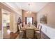 Dining room with a large window, hardwood floors, and decorative wainscoting at 1382 Fountain Lakes Drive Dr, Lawrenceville, GA 30043