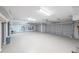Spacious garage with a three-car capacity, storage shelving, and an automatic door opener at 1382 Fountain Lakes Drive Dr, Lawrenceville, GA 30043