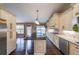 Bright kitchen with island, custom cabinets, stainless appliances, and hardwood floors at 1382 Fountain Lakes Drive Dr, Lawrenceville, GA 30043