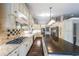 Open kitchen with stainless steel appliances, granite countertops, and custom cabinetry at 1382 Fountain Lakes Drive Dr, Lawrenceville, GA 30043