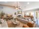 Bright living room featuring a fireplace, hardwood floors, and an open concept layout at 1382 Fountain Lakes Drive Dr, Lawrenceville, GA 30043