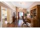 Elegant office space with hardwood floors, custom built-ins, and natural light, creating an ideal work-from-home environment at 1382 Fountain Lakes Drive Dr, Lawrenceville, GA 30043