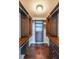 Walk-in closet featuring hardwood floors, custom shelving, and ample storage at 1382 Fountain Lakes Drive Dr, Lawrenceville, GA 30043