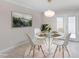 Bright dining area featuring a glass-top table with seating for four, perfect for Gathering meals and entertaining at 3210 Quincetree Lane Ln, Decatur, GA 30034