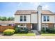 Charming two-story townhouse with a brick facade, complemented by vinyl siding and a well-manicured lawn at 3210 Quincetree Lane Ln, Decatur, GA 30034