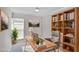 Bright home office featuring a wooden desk, bookcase, and cozy chair, ideal for remote work at 3210 Quincetree Lane Ln, Decatur, GA 30034