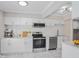 Modern kitchen with white cabinets, stainless steel appliances, and ample counter space, perfect for cooking at 3210 Quincetree Lane Ln, Decatur, GA 30034