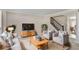 Inviting living room with plush seating, a wooden entertainment center, and a staircase, creating a warm atmosphere at 3210 Quincetree Lane Ln, Decatur, GA 30034