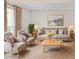 Bright living room featuring neutral decor, stylish seating, a large window, and decorative accents at 3210 Quincetree Lane Ln, Decatur, GA 30034