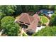 Aerial shot of the luxurious estate, showcasing the home's layout, pool, and landscaped grounds at 10630 N Edgewater Pl, Johns Creek, GA 30097
