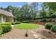 Lush backyard features a well-maintained lawn, garden beds, and privacy fence at 10630 N Edgewater Pl, Johns Creek, GA 30097